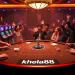 Players enjoying an exciting game at khela88's vibrant casino table with colorful poker chips.